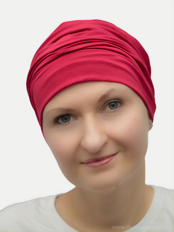 Fashionable red turban for cancer and chemo patients, made from cotton.