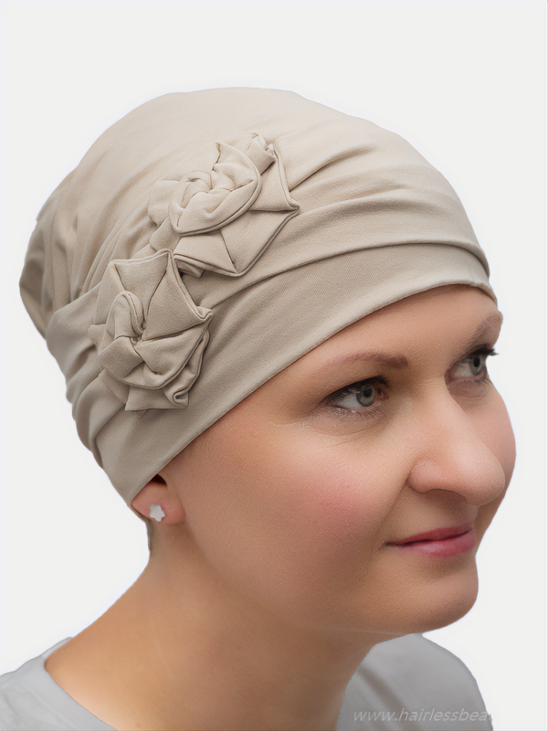 Fashionable beige headwear made from soft, breathable bamboo fabric, ideal for casual or formal occasions