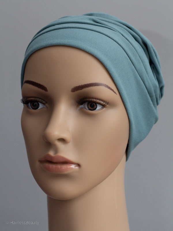 Loose-fitting, comfortable beanie hat, offering light protection for sensitive scalps of chemo and radio therapy patients