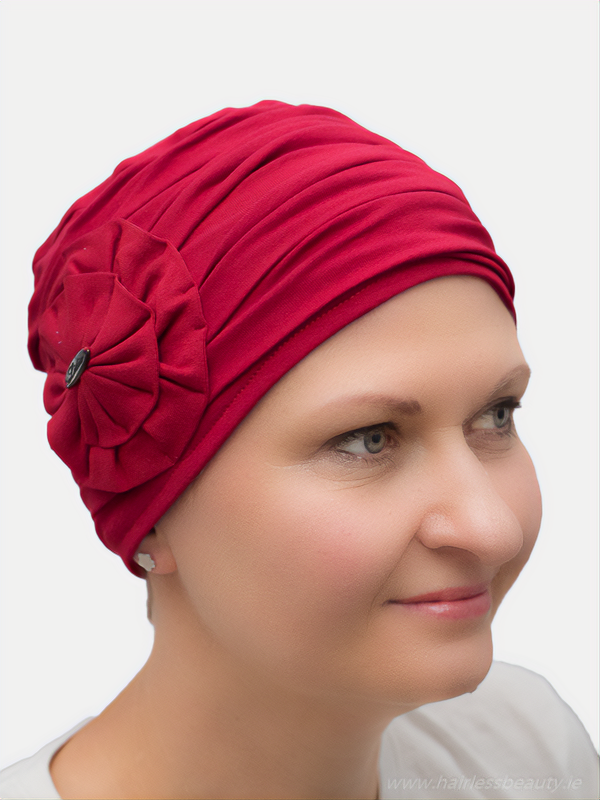 Pretty, red bamboo turban with delicate draping fabric, offering volume and a soft, lined interior, ideal for alopecia